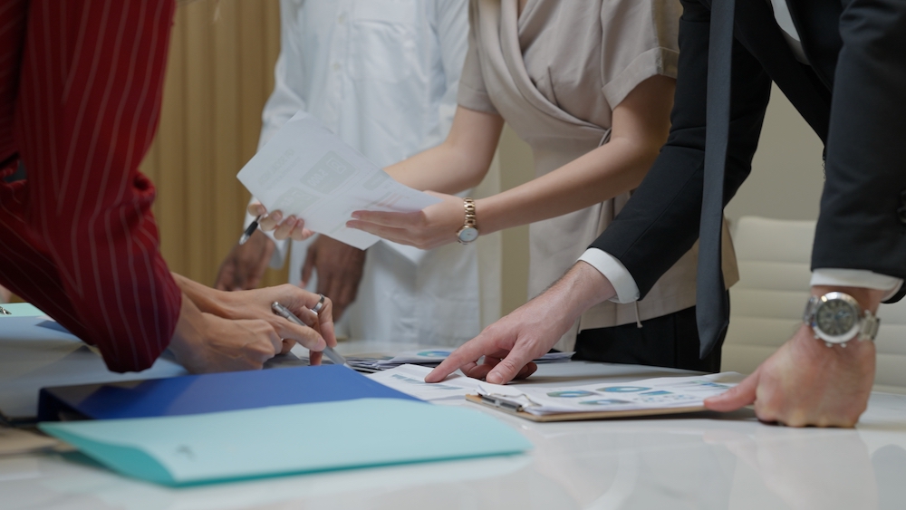 Business officer team consulting together with new project Business officer team consulting together with new project