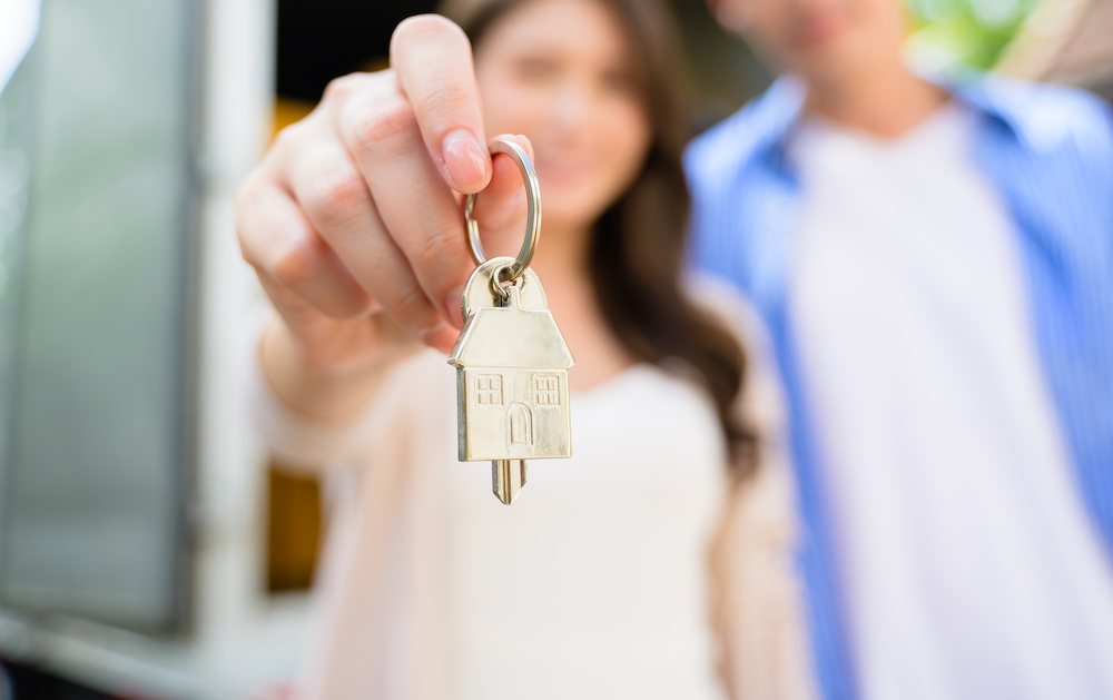 Couple of husband and wife holding key of new house, People spending time together in new house, New life with new home Couple of husband and wife holding key of new house, People spending time together in new house, New life with new home